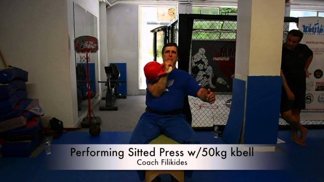 '50kg Kettlebell sitted press Filikides Fight Fitness'