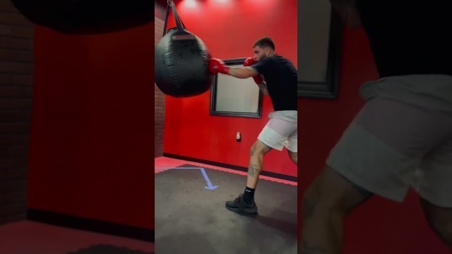 'Pro Boxer doing heavy bag work @ 9round Downtown KC Kickboxing Fitness'