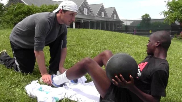 'Fitness Coach T.C. working out Franic Tiafoe at the JTCC'